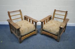 A PAIR OF ERCOL OAK LOW ARMCHAIRS, with a height adjustable back rest, width 71cm x depth 88cm x