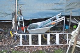 A BUILDERS WHEELBARROW, two aluminium step ladders, and a quantity of garden tools (12+)
