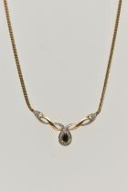 A 9CT GOLD SAPPHIRE AND DIAMOND PENDANT NECKLACE, pendant set with a pear cut deep blue sapphire,