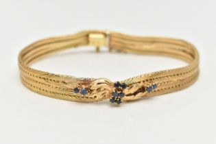 A YELLOW METAL GEM SET BRACELET, ten circular cut blue sapphires, prong set in a yellow metal