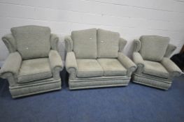 A LIGHT GREEN UPHOLSTERED THREE PIECE SUITE, comprising a two seater sofa, length 133cm x depth 93cm