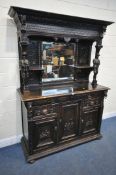 AN EARLY 20TH CENTURY OAK CONTINENTAL MIRROR BACK SIDEBOARD, fitted with an arrangement of lion