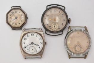 FOUR MID 20TH CENTURY WATCH HEADS, to include a white metal 'Olma' watch head, missing crown,