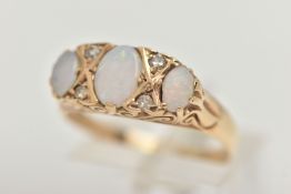 A YELLOW METAL OPAL AND DIAMOND RING, designed with three oval cut opals, interspaced with four