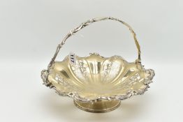 A WHITE METAL CAKE BASKET DISH, the dish with openwork foliate detail within a floral and