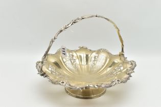 A WHITE METAL CAKE BASKET DISH, the dish with openwork foliate detail within a floral and