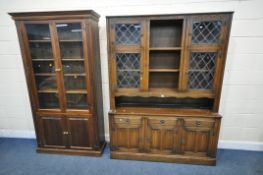 A 20TH CENTURY OAK BOOKCASE, fitted with four lead glazed doors, flanking a central shelving