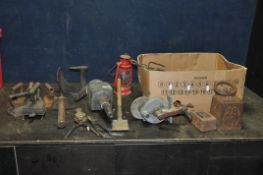 A TRAY CONTAINING VINTAGE COLLECTABLES including a 28lb weight, a 7lb weight, four irons, an iron on