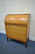 A MID CENTURY TEAK CYLINDER BUREAU, with a fitted interior and brushing slide, above three