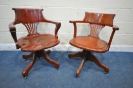 TWO 20TH CENTURY STAINED OFFICE CHAIRS, with open armrests, sprung mechanism, on four shaped legs (