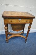 A VICTORIAN WALNUT AND INLAID WORK TABLE, the revolving surface with a chess board, enclosing
