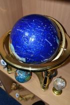 A BLUE LAPIS GEMSTONE TABLE GLOBE, each continent of the globe is inlaid with various semi-