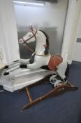 A RAGAMUFFIN TOYS LTD ROCKING HORSE, the grey and black spotty painted fibreglass leaping horse