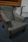 A FLORAL UPHOLSTERED ARMCHAIR, width 72cm (condition report: good)