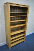 A JB GLOBAL LIGHT OAK OPEN BOOKCASE, with five adjustable and two fixed shelves, width 100cm x depth
