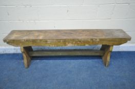 AN 20TH CENTURY ELM BENCH, with trestle legs, united by a block stretcher, length 170cm x depth 31cm
