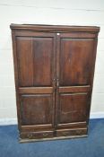 AN OAK DOUBLE DOOR WARDROBE, with two drawers, width 125cm x depth 51cm x height 187cm (condition