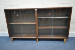 A MID CENTURY TEAK VANSON SIDE BY SIDE BOOKCASE, with a pair of double glazed sliding doors,