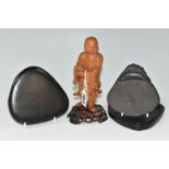 AN ORIENTAL CARVED WOOD FIGURINE, a boxwood carved figure of a smiling Chinese monk bearing a basket