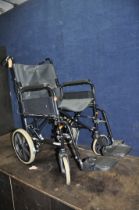 A REMPLOY FOLDING WHEELCHAIR with two footrests