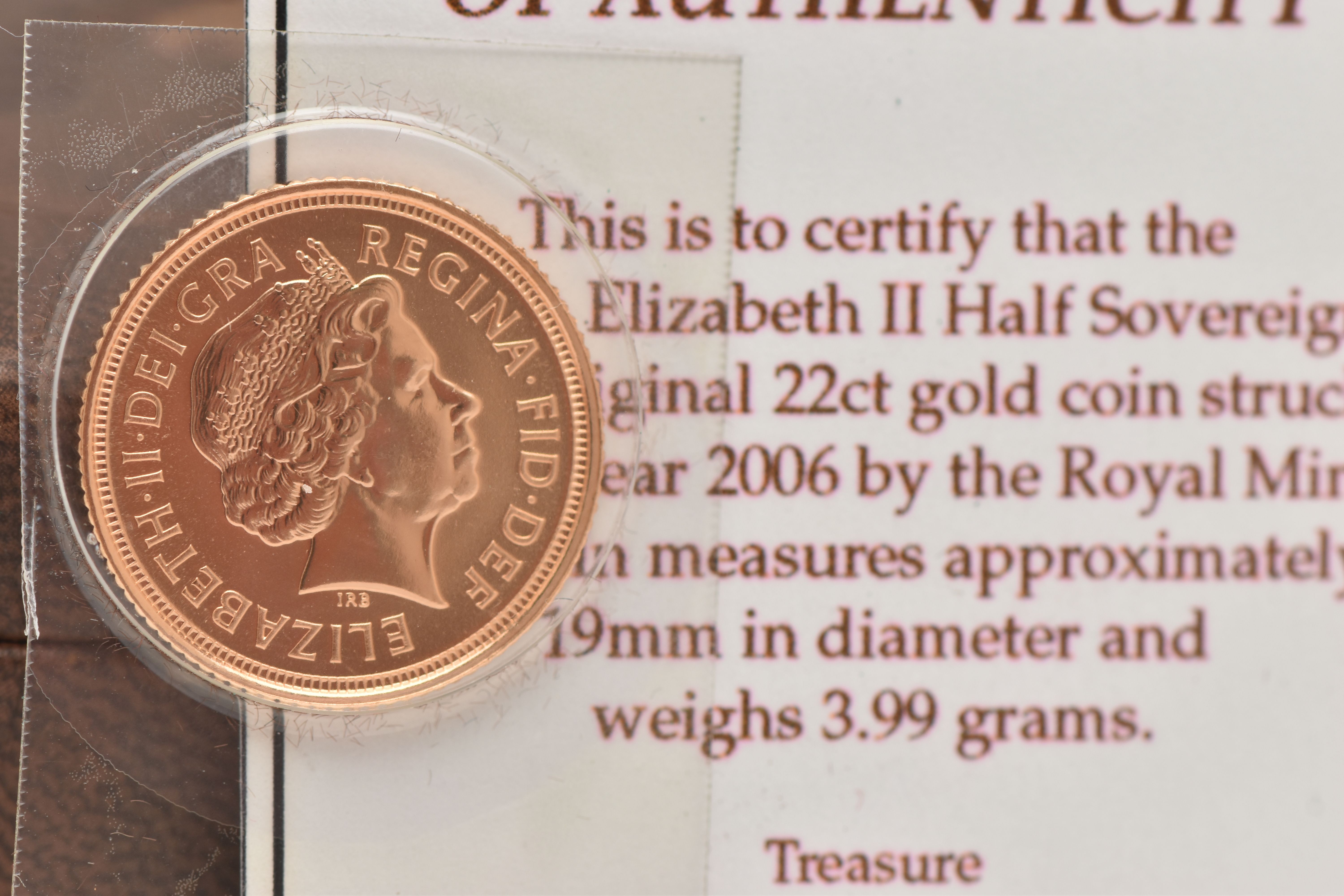 A BOXED 2006 ELIZABETH II, 22CT GOLD HALF SOVEREIGN COIN, 3.99 grams, 19mm, in blister pack with box - Image 2 of 2