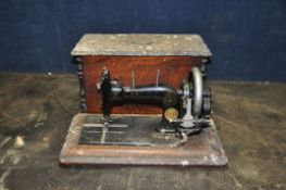 A VINTAGE PFAFF MANUAL SEWING MACHINE with distressed magogany case