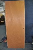 A USED BUT UNPAINTED FIRE DOOR with 76.5cm height 198.5cm (appears to be square)
