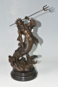 A MODERN BRONZE SCULPTURE OF POSEIDON, depicting the Greek God emerging from the waves holding his