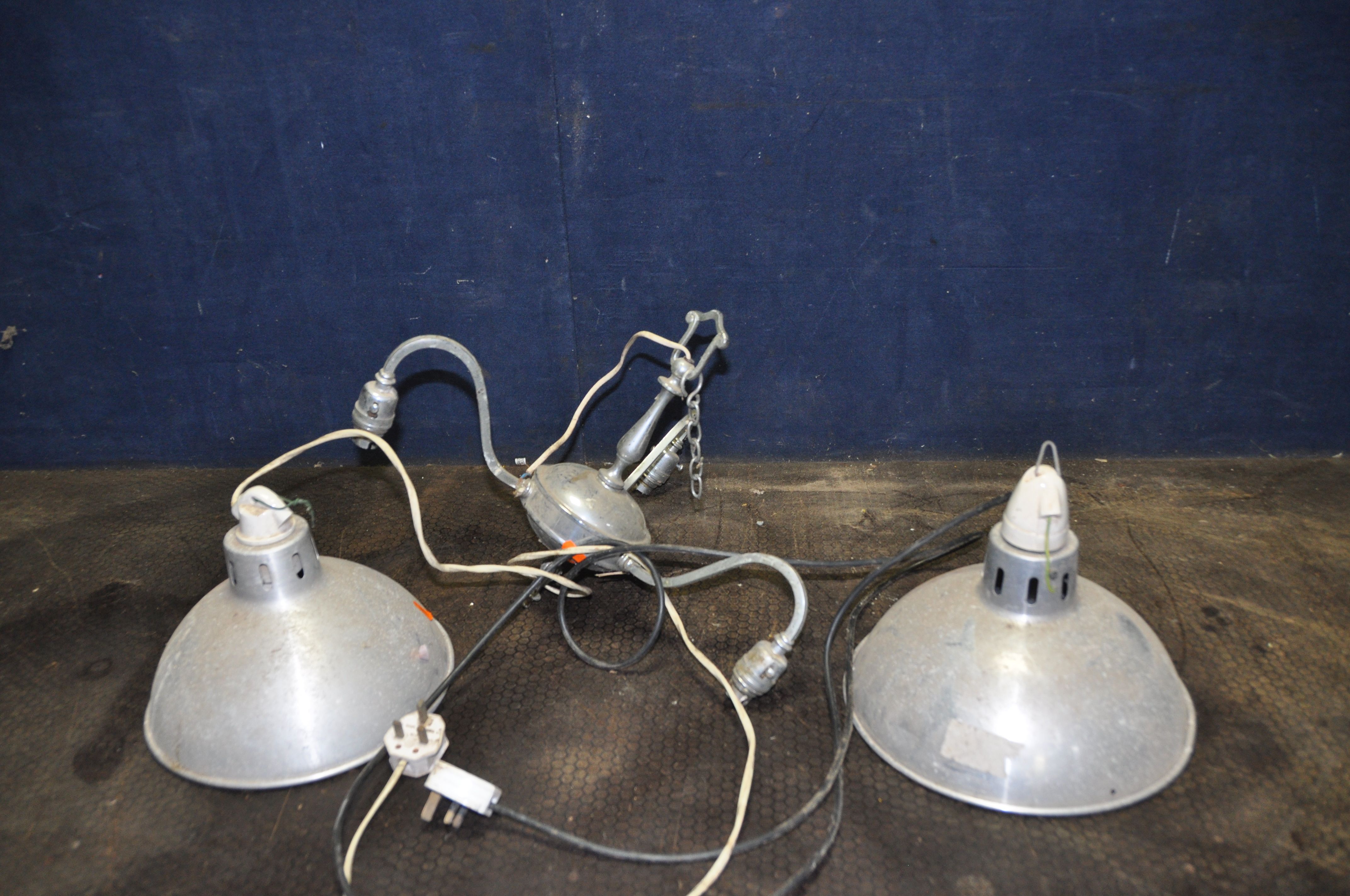 A PAIR OF VINTAGE ALUMINIUM INDUSTRIAL LIGHTS with screwfit ceramic bulb holders and a chrome
