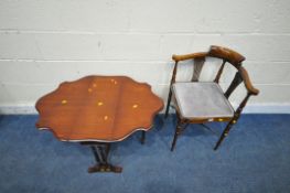 AN EDWARDIAN MAHOGANY BOW TOP CORNER CHAIR, with swept armrests, raised on turned supports and