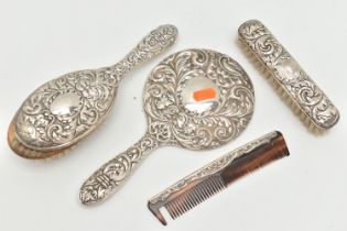 A FOUR PIECE SILVER VANITY TABLE SET, comprising of a hair brush, clothes brush, hand held mirror
