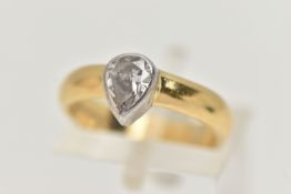AN 18CT GOLD PEAR CUT DIAMOND RING, the pear cut diamond within a collet setting to the plain