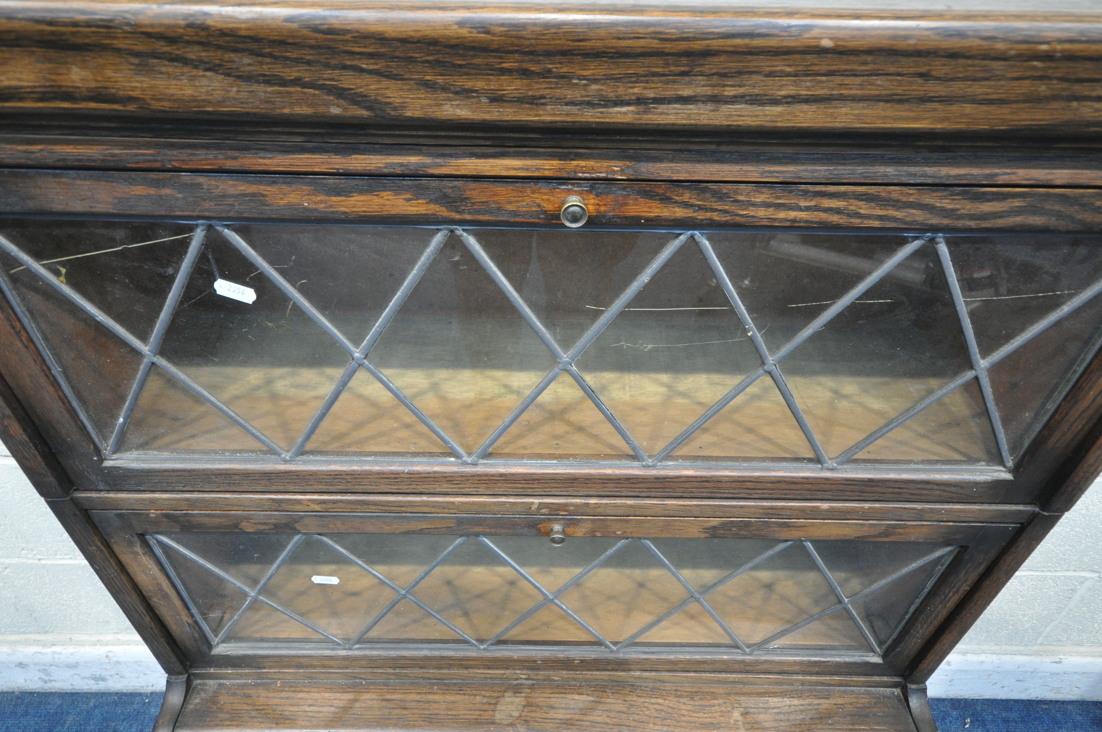 A 20TH CENTURY OAK SECTIONAL BOOKCASE, with fall front lead glazed doors, width 84cm x depth 33cm - Image 2 of 4