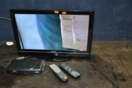 A TOSHIBA 22DV501B 22in TV with remote (DVD not working) and a Goodman's Freesat box (powers up
