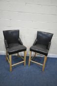 A PAIR OF BEECH FRAMED BAR STOOLS, with brown leatherette upholstery (condition report: general
