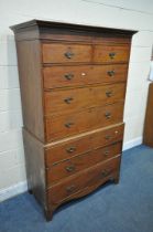 A GEORGIAN MAHOGANY CHEST ON CHEST, fitted with an arrangement of eight drawers, a loose cornice,