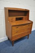 POSSIBLY SVEND MADSEN, A MID CENTURY DANISH TEAK DESK, fitted with an arrangement of seven drawers