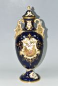 A COALPORT COVERED PEDESTAL VASE, with pierced twin handles, a cobalt blue patterned ground with