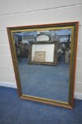 A GILT AND PARTIALLY PAINTED FRAMED RECTANGULAR BEVELLED EDGE WALL MIRROR, 137cm x 106cm (