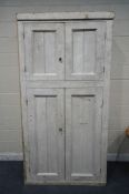 A HEAVY 19TH CENTURY WHITE PAINTED PINE HOUSEKEEPERS CUPBOARD, with two small and two large doors,