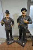 A PAIR OF LIFE SIZE PAINTED FIBREGLASS FIGURES OF THE FAMOUS COMEDIC LEGENDS LAUREL AND HARDY,