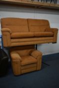 AN ORANGE UPHOLSTERED TWO PIECE LOUNGE SUITE, comprising a large two seater sofa, length 213cm,