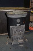 A GODIN CAST IRON MULTI FUEL STOVE with black and grey enamel finish, oval in shape, height 75cm