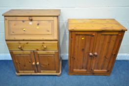 A MODERN PINE BUREAU, the fall front door enclosing a fitted interior, above a single drawer and