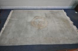 A GREEN GROUND KAYAM WOOLEN RUG, with a cental medallion depicting a Chinese dragon and a