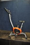A BODY FIT EXERCISE BIKE with digital display