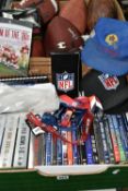 A QUANTITY OF ASSORTED NFL MEMORABILIA, to include a collection of Superbowl and other DVDs,