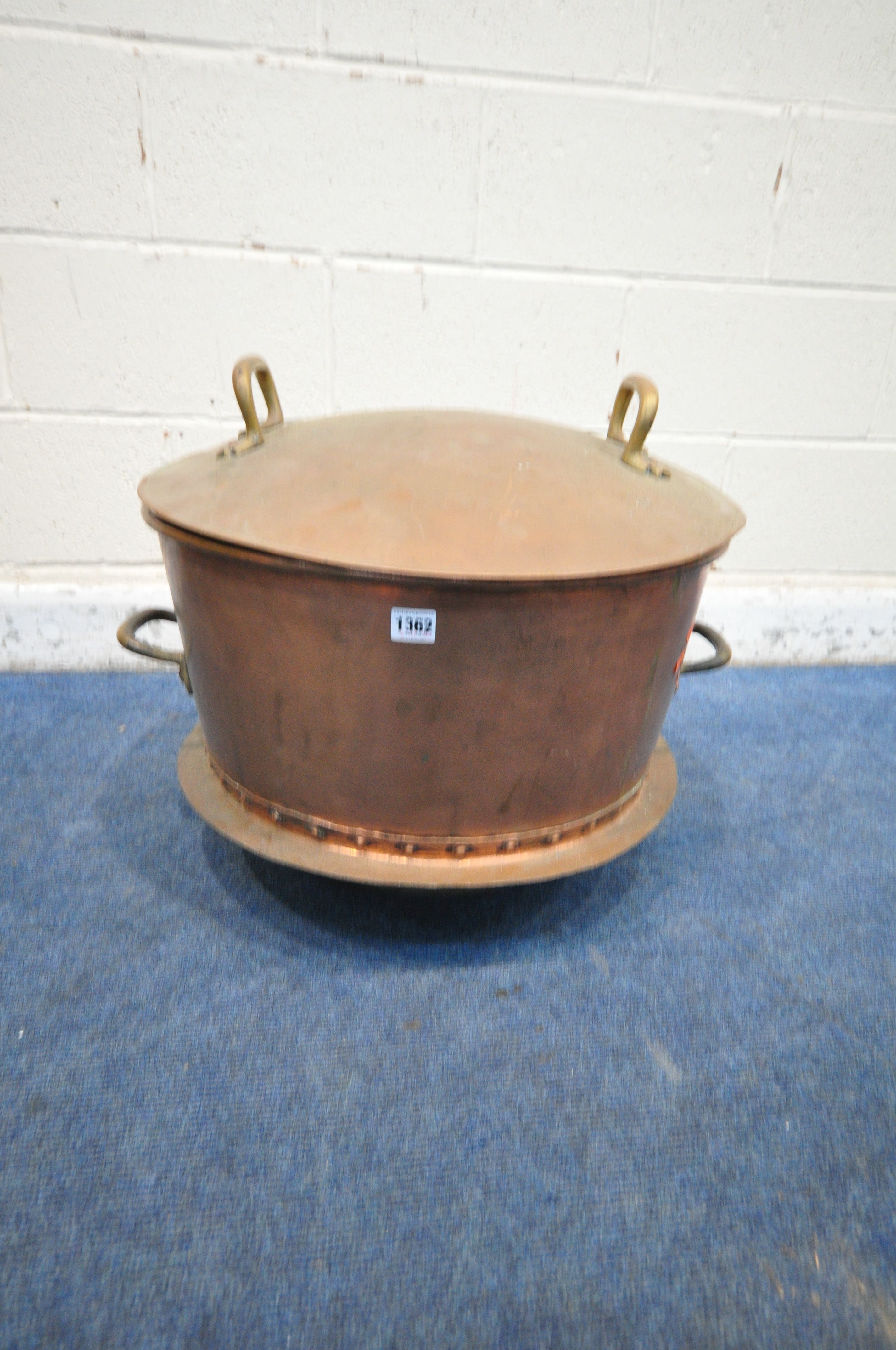 A 20TH CENTURY LARGE COPPER CAULDRON, with twin brass handles to pot and lid, a rounded bottom,