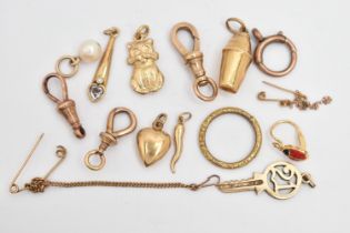 AN ASSORTMENT OF 9CT GOLD AND YELLOW METAL, to include a 21 key charm and a cocktail shaker charm,