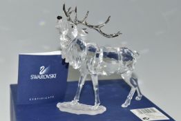 A BOXED SWAROVSKI CRYSTAL 'STAG' SCULPTURE, depicting a stag with metal antlers, model no 291431,